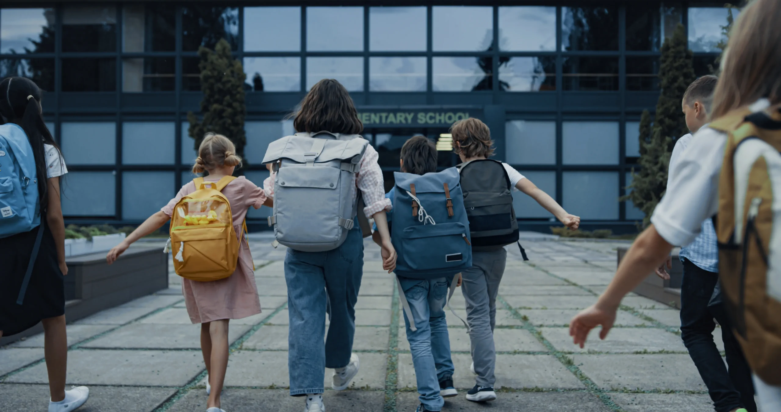 children walking into elementary school